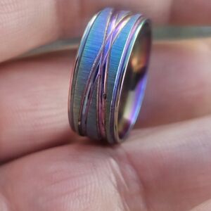 unique ring features a vibrant, iridescent finish